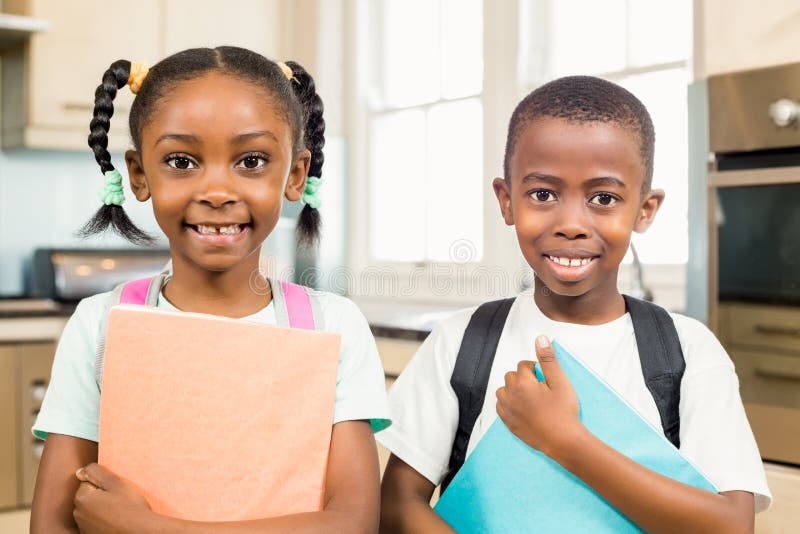 Cute Siblings Ready for School Stock Image - Image of cabinets, holding