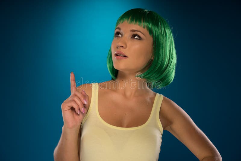 Cute Slender Young Woman with Green Hair Stock Photo