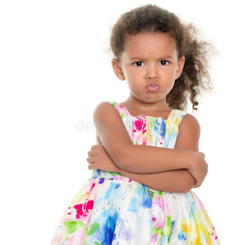 Cute small girl making a funny angry face isolated on white