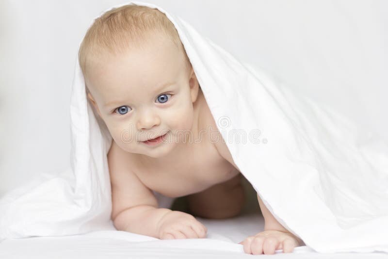 Cute Smiling Baby Boy Looking at Camera Under a White Blanket or Towel Stock Image Image of