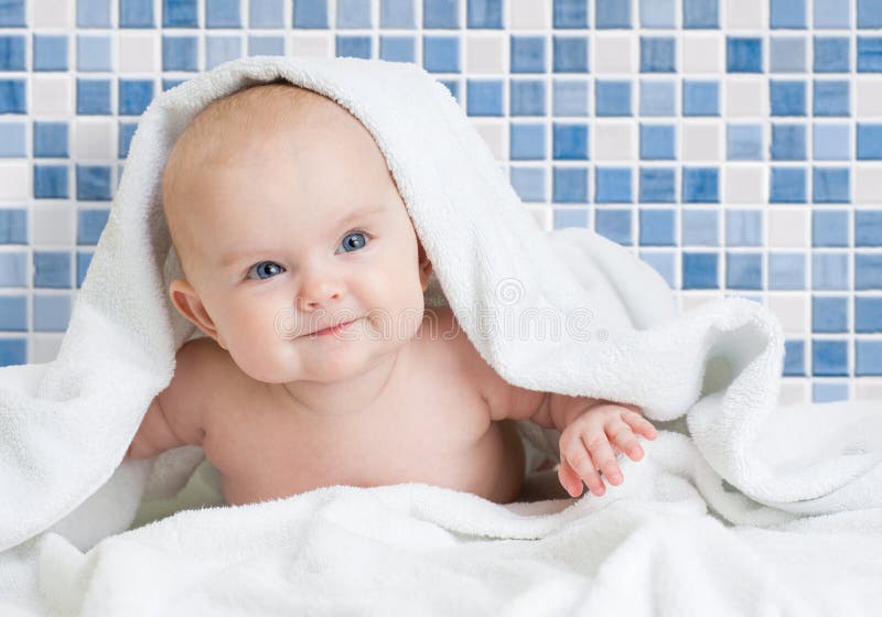 Cute smiling baby kid after bathing in bathroom royalty free stock image