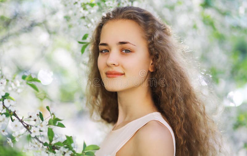 Cute smiling girl outdoors, sunny spring portrait young girl