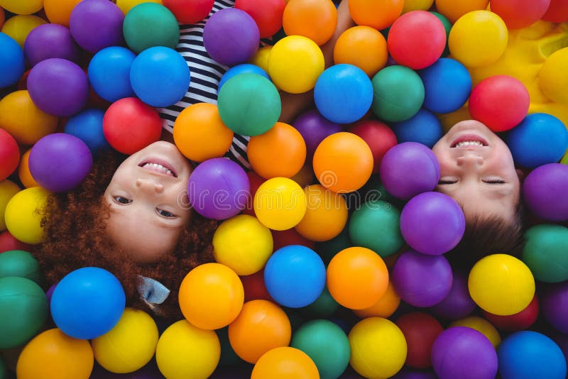 Cute smiling kids in sponge ball pool stock photography Cute smiling kids in sponge ball pool stock photography