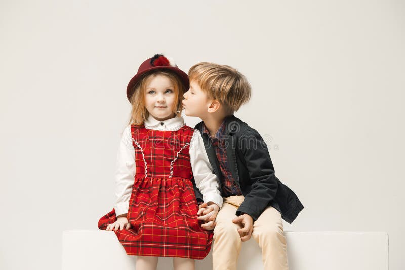 Cute stylish children on white studio background