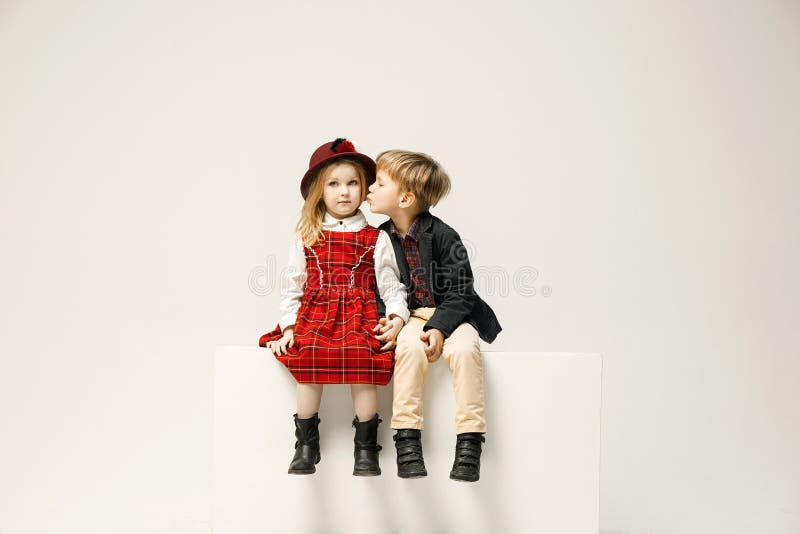 Cute stylish children on white studio background