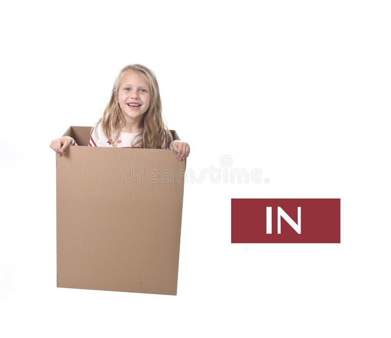 Cute and sweet blond hair child in cardboard box isolated on white background in learning english prepositions. And words language card set for education school royalty free stock images Cute and sweet blond hair child in cardboard box isolated on white background in learning english prepositions. And words language card set for education school royalty free stock images