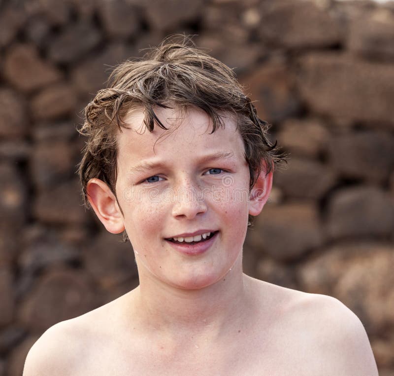 Cute teen boy with wet hair