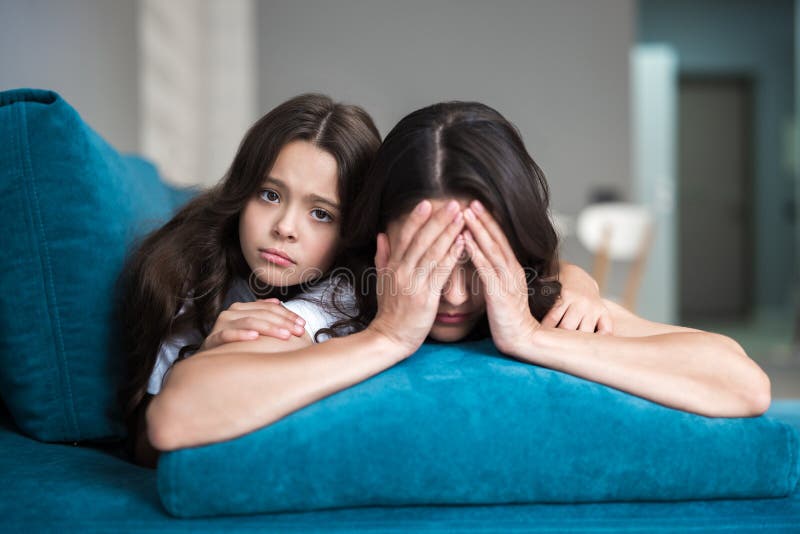 Cute teen daughter supporting feeling pitty for her young mother who is feeling upset stock images Cute teen daughter supporting feeling pitty for her young mother who is feeling upset stock images