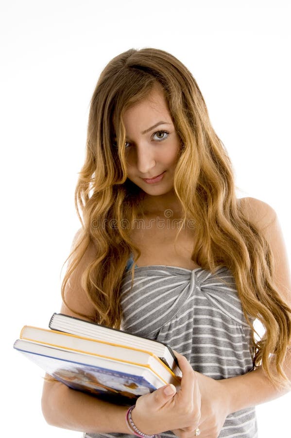 Cute teenager holding books