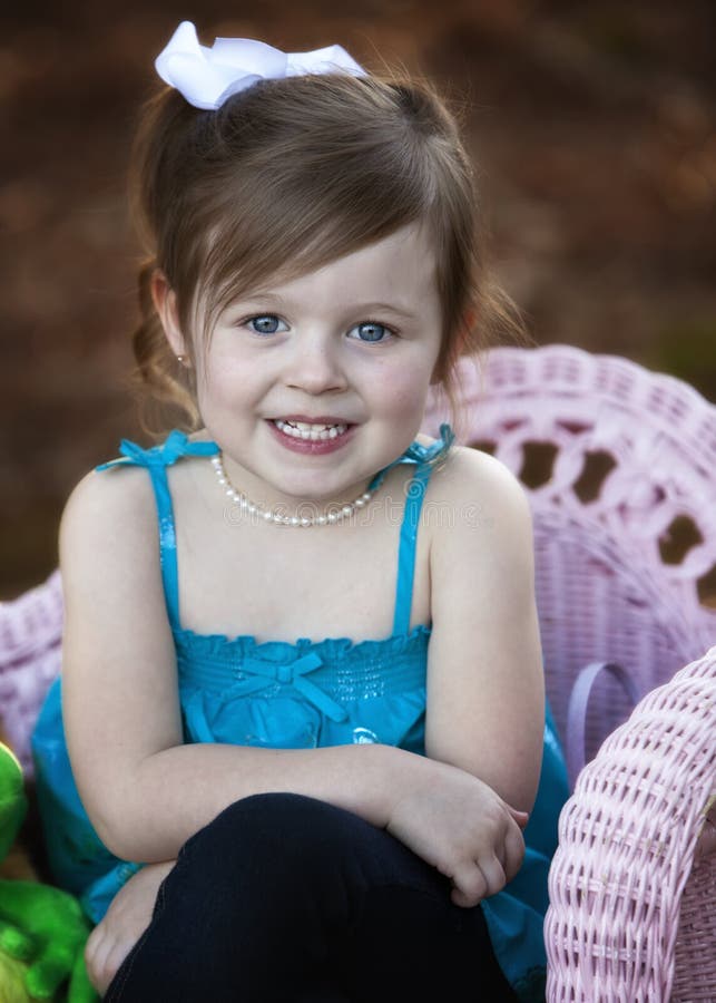 Cute Three Year Old Brunette Girl Outdoors Stock Photo