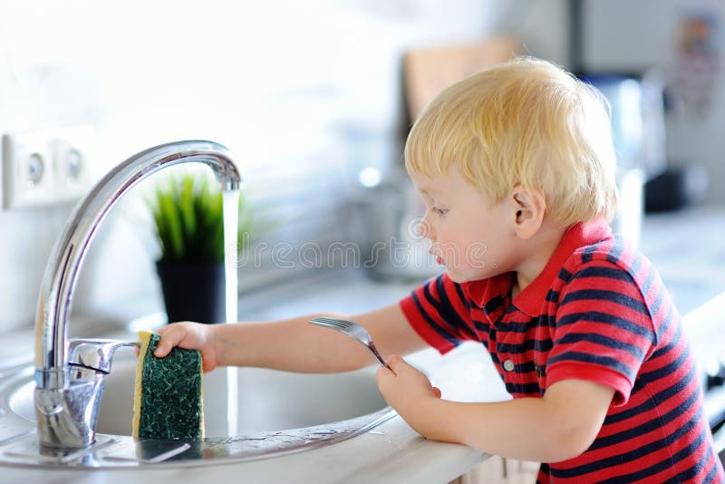Cute Toddler Boy Washing Dishes In Domestic Kitchen Stock Image Image