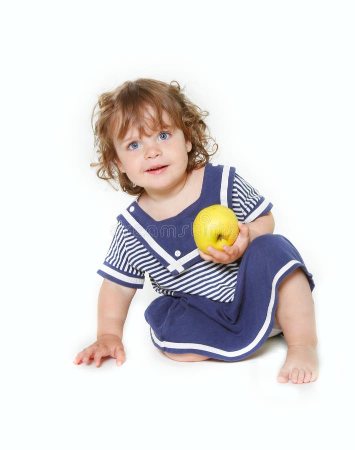 Cute toddler girl with green apple