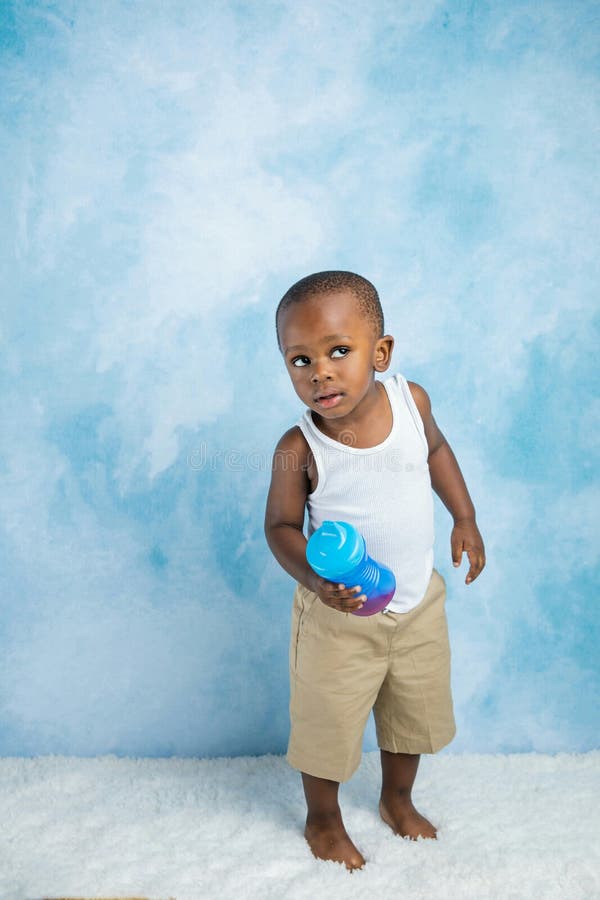 Cute Toddler Preschool Age Little Boy Holding a Sippy Cup Stock Image -  Image of football, baby: 192717141
