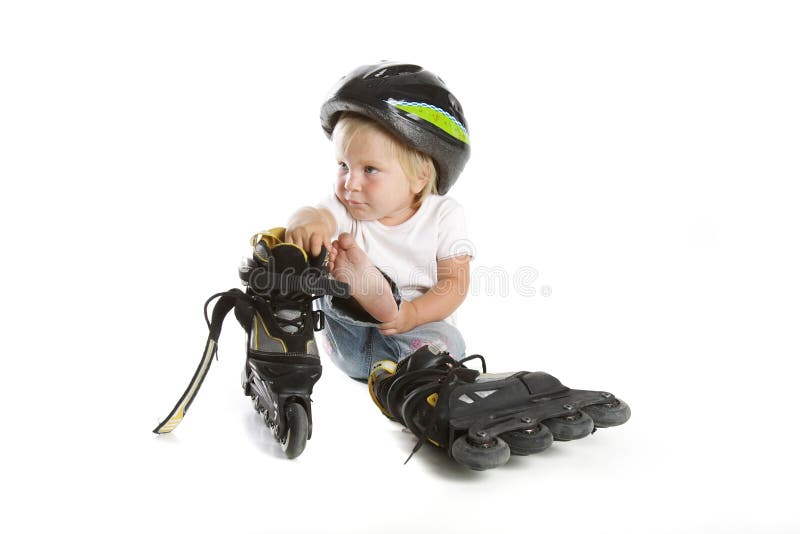 Cute toddler with rollerskates