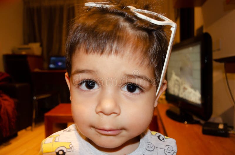 Cute Two Years Old Boy Playing with White Glasses and Making Funny