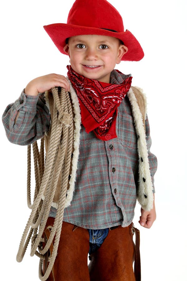 Cute very young cowboy holding a rope smiling stock photos Cute very young cowboy holding a rope smiling stock photos