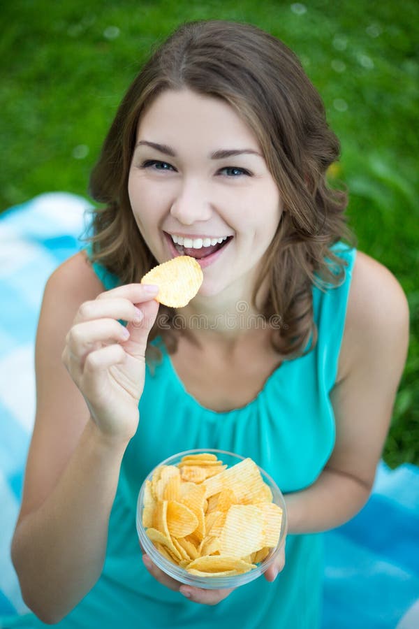 Cute Woman Eating Potato Chips in Park Stock Photo Image of cute