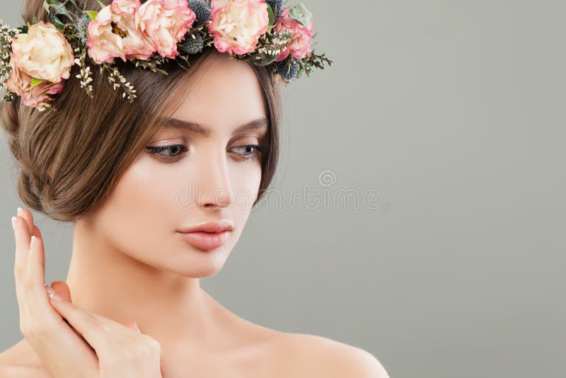 Cute woman with flowers, summer spa portrait. Beautiful face stock photos Cute woman with flowers, summer spa portrait. Beautiful face stock photos