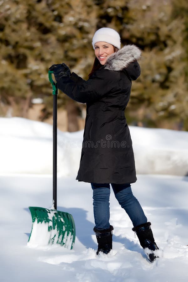 Cute Woman shoveling snow stock image. Image of beautiful 18244385