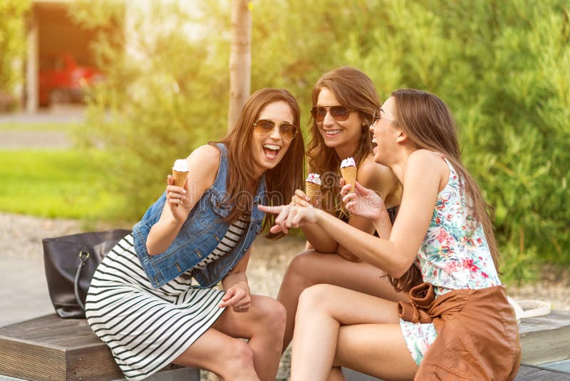 3 cute women, ice cream parlors, while laughing