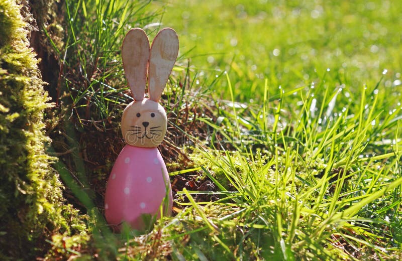 Cute Wooden Easter Bunny in Fresh Green Grass and Sunlight Stock Photo ...