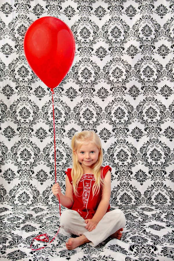 Cute Young Blond Girl with Red Balloon