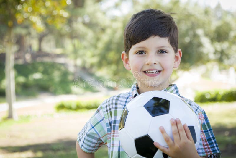 Cute Young Boy Playing With Soccer Ball In Park Stock Photo Image of