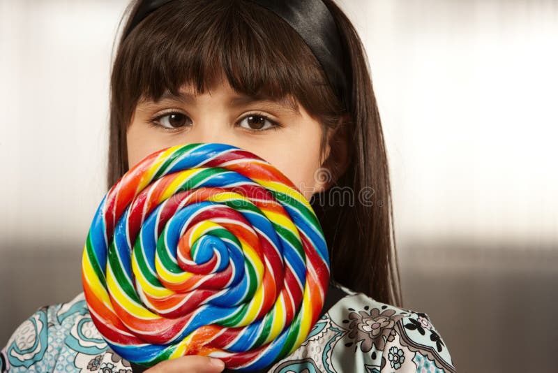 Cute young girl with lollipop