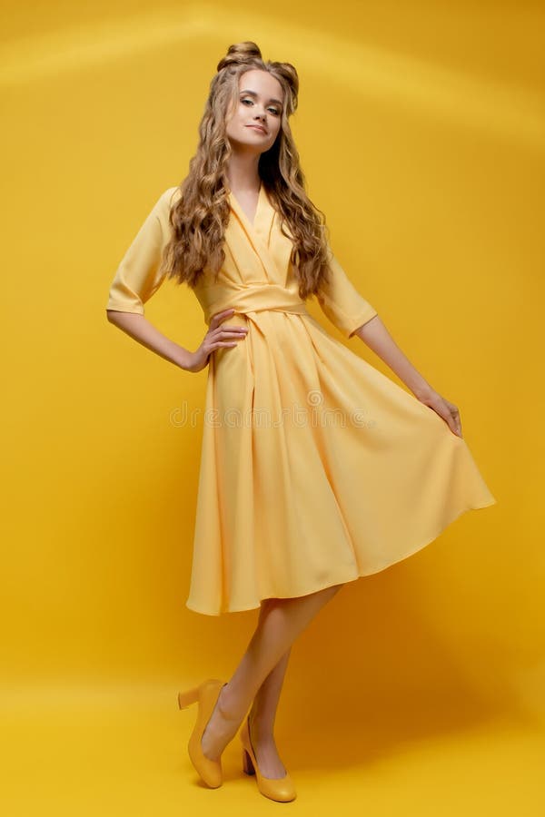 Cute Young Girl in a Yellow Dress on a Yellow Background with a Haircut and Curly Long Hair. Stock Photo - Image of odango, aesthetics: 152723452 Cute Young Girl in a Yellow Dress on a Yellow Background with a Haircut and Curly Long Hair. Stock Photo - Image of odango, aesthetics: 152723452