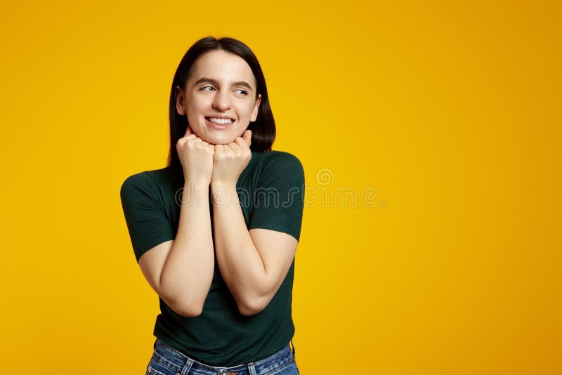 Girl Keeps Clenched Fists Together Under Chin, Looking at Free Empty ...