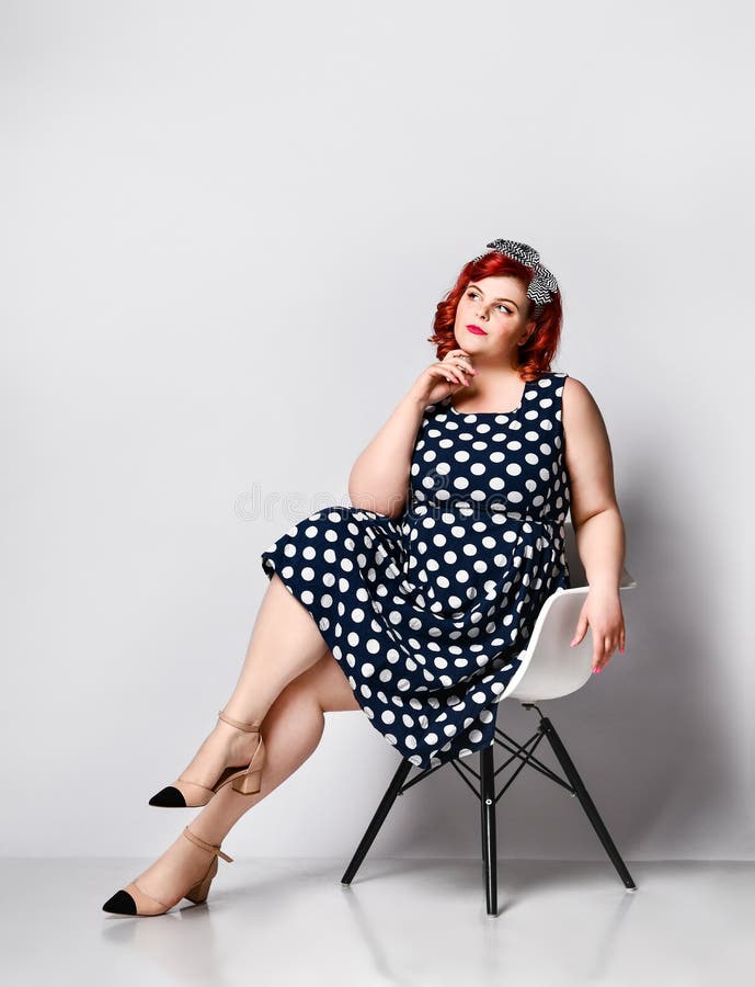 Pin up a female portrait. Beautiful retro fat woman in polka dot dress with red lips and old-style haircut royalty free stock photos Pin up a female portrait. Beautiful retro fat woman in polka dot dress with red lips and old-style haircut royalty free stock photos