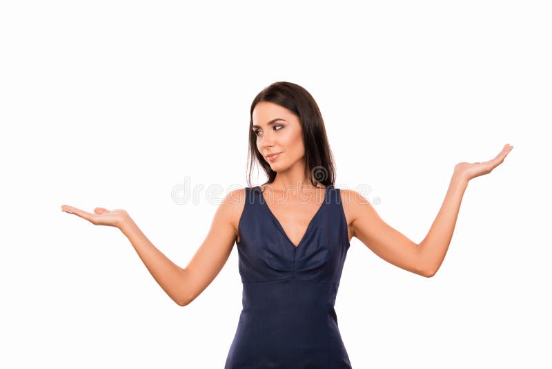 Cute young woman choosing between two alternatives stock image Cute young woman choosing between two alternatives stock image