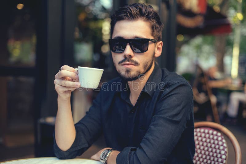 Cutie Man with Cup of Coffee Looking at Mobile Phone Outdoors Stock ...