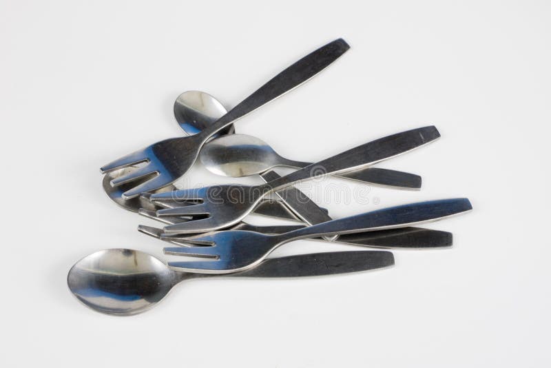 Cutlery Arranged on a White Kitchen Table. Accessories for Kitchen and