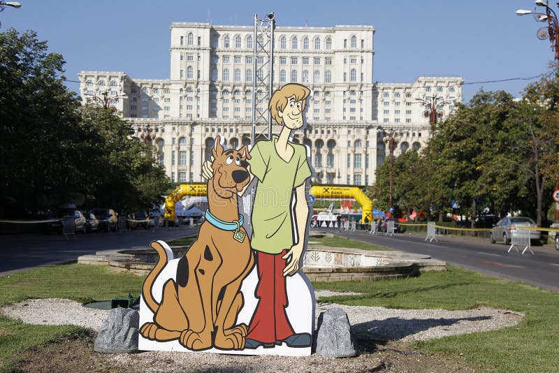 Cutout with Scooby-Doo at the Bucharest Raiffeisen International Marathon with House of the People (Casa Poporului in romanian) in background. Cutout with Scooby-Doo at the Bucharest Raiffeisen International Marathon with House of the People (Casa Poporului in romanian) in background