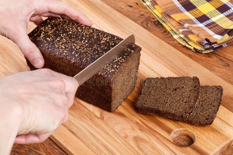 Cutting Black Bread royalty free stock photo Cutting Black Bread royalty free stock photo