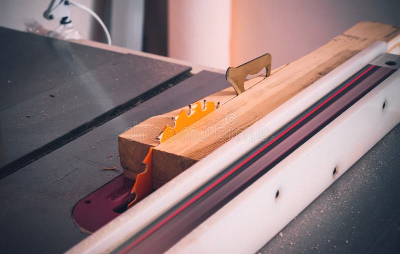 Cutting the Board on a Circular Saw in a Woodworking Stock