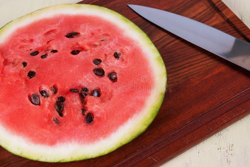 Cutting Board with a Knife and Ripe Watermelon. Stock Image Image of