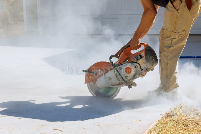 Cutting Concrete Paving Slabs for Sidewalks with a Diamond Bladed Saw