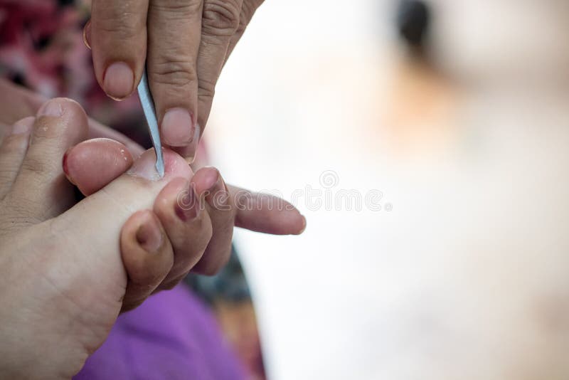 Premium Photo | Nail clipping, senior woman foot cutting nails using nail  clipper