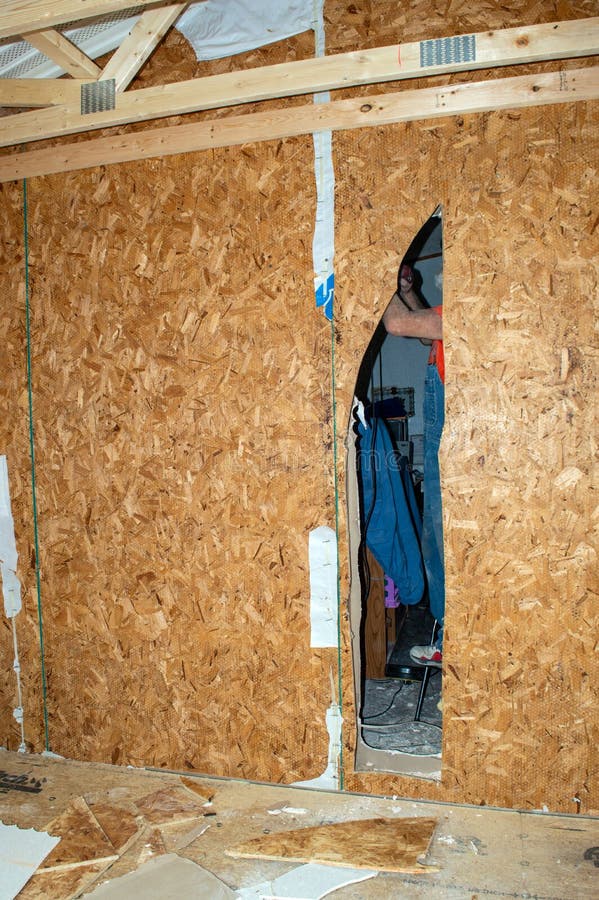 Cutting doorway in wall stock photo. Image of change 254409410