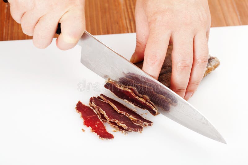 Cutting the dried beef stock photo. Image of wooden, dried 50042328