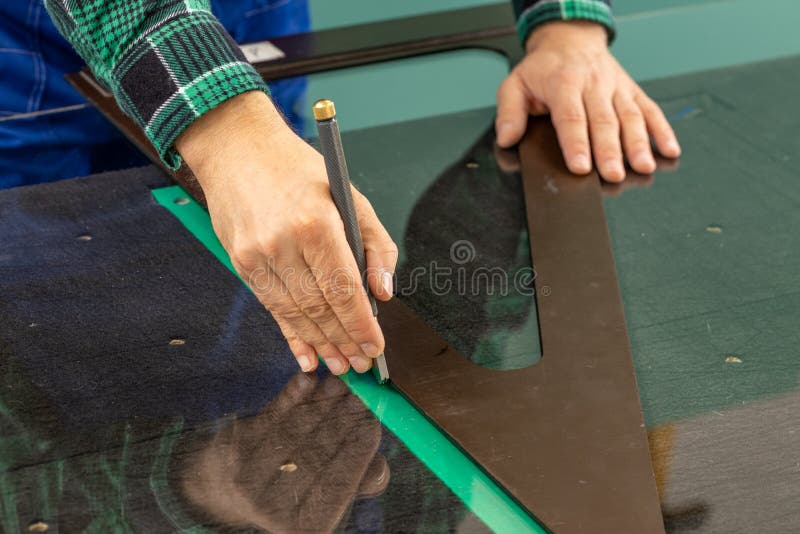 Cutting Glass, Glazier Manually Cuts the Glass To Size Using