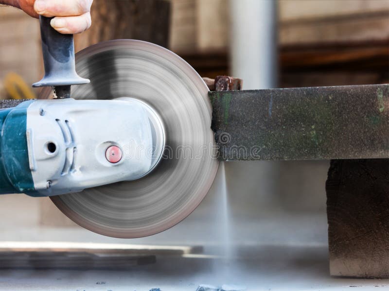 Cutting hard stone grinder stock photo. Image of hand 40068132