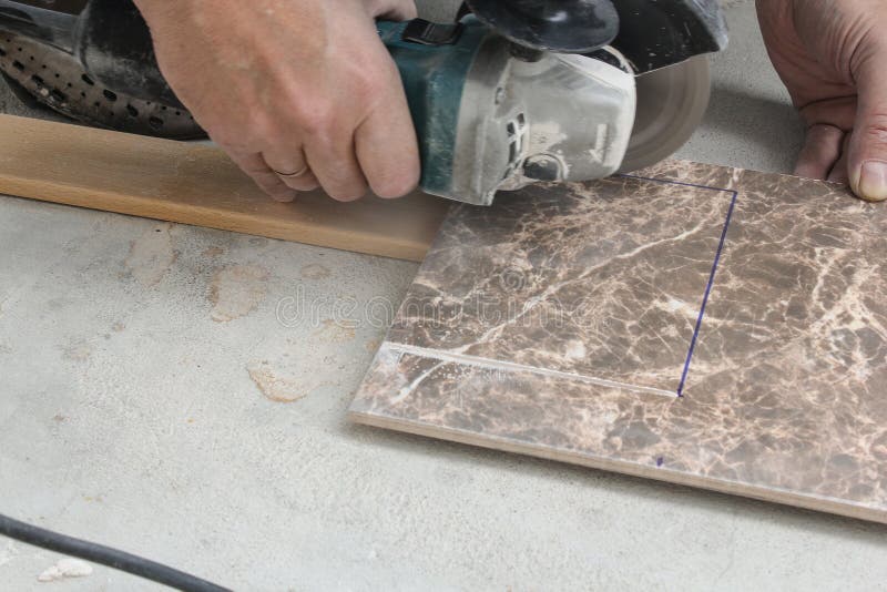 Cutting Holes in the Tile Shaped Power Tool. Stock Image Image of
