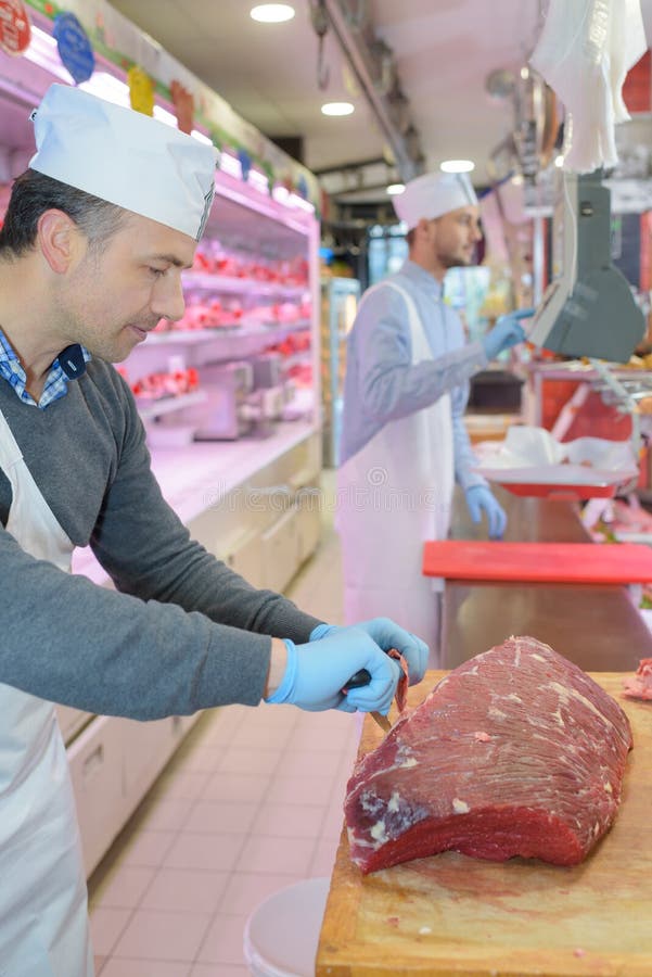 He cutting meat stock image. Image of manual, assistant 258971181