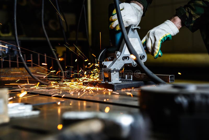 Cutting metal with electric circular cutter tool stock image Cutting metal with electric circular cutter tool stock image