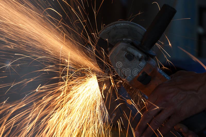 Cutting metal with grinder royalty free stock photo Cutting metal with grinder royalty free stock photo