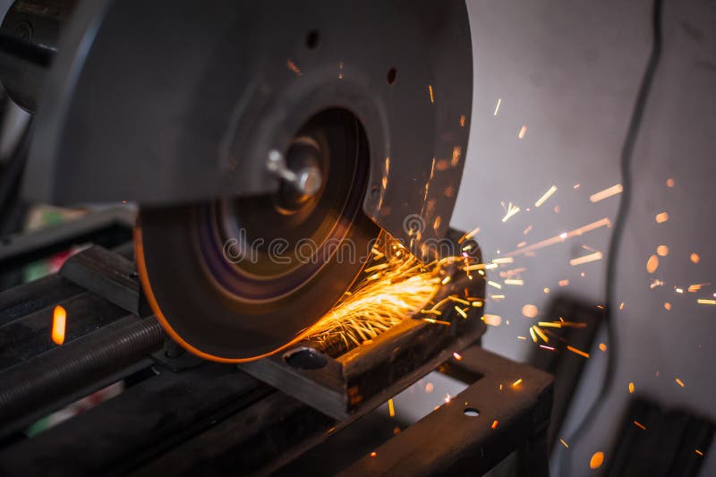 Cutting Metal with Grinder in Sparks while Grinding Iron