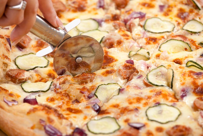 Cutting pizza stock image. Image of cuisine, colour, delicious 9865567